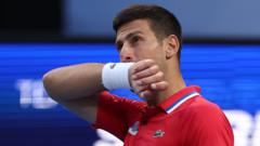 djokovic-beaten-by-de-minaur-as-australia-progress