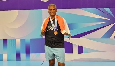 dr.-manimara-chozhan-shines-at-the-world-masters-badminton-championship